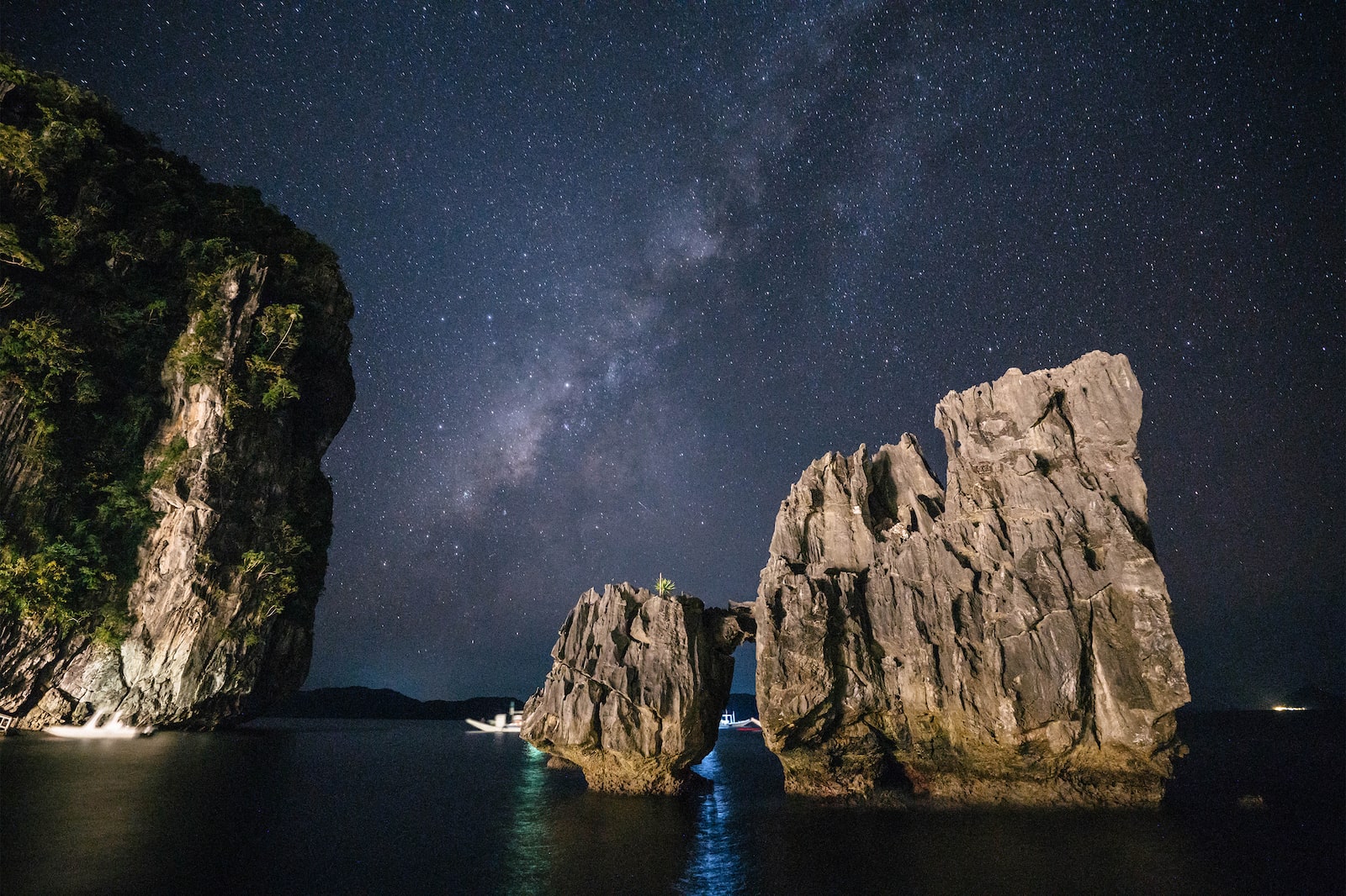 El Nido rock formations against starry night skies