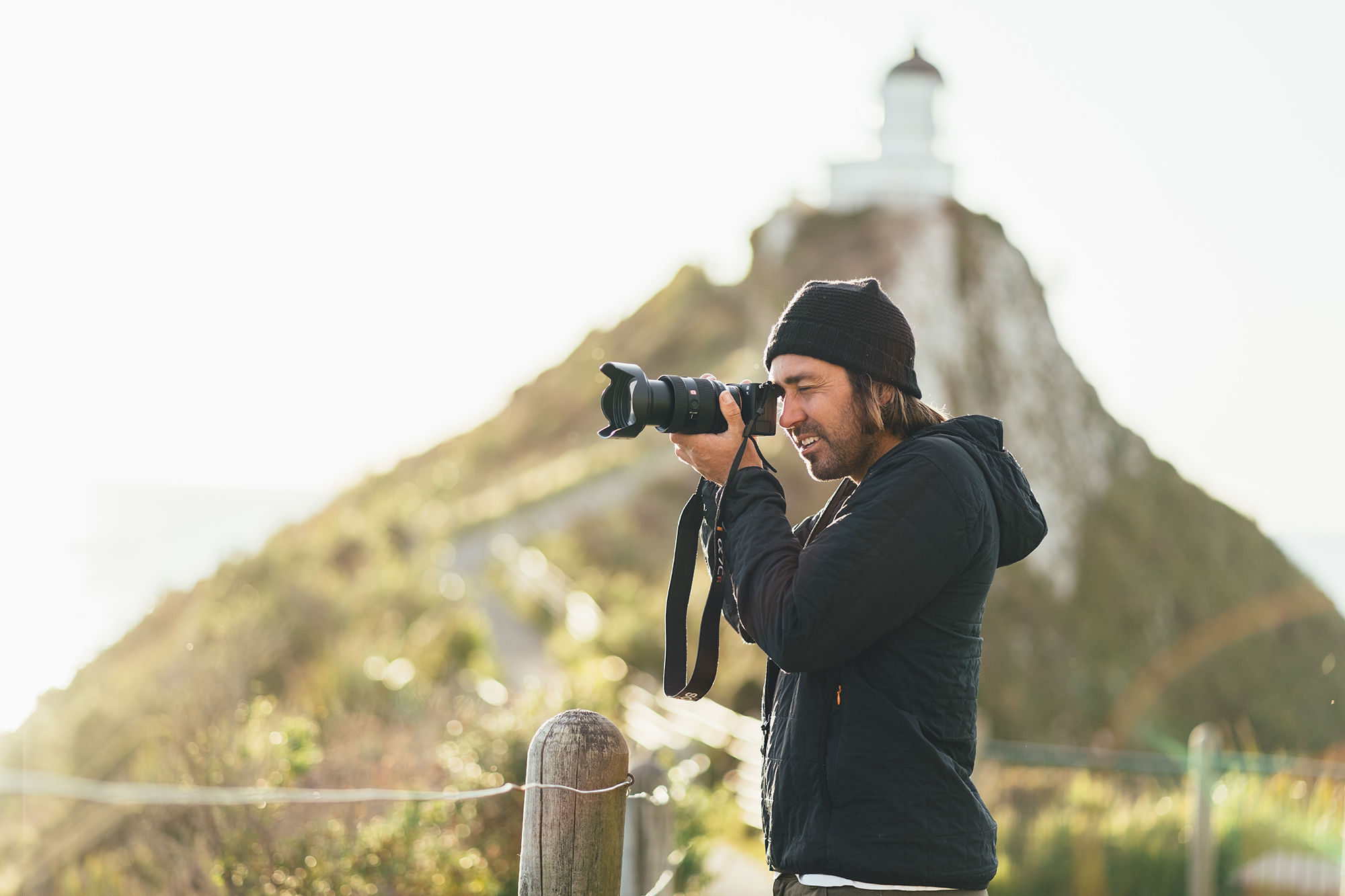 Posing in front of the lighthouse